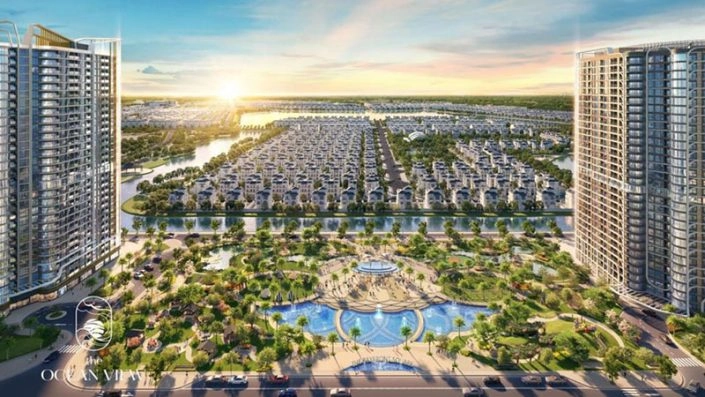 Cổng chào dự án với hai tòa chung cư cao tầng, quảng trường trung tâm và khu biệt thự liền kề hướng ra hồ lớn