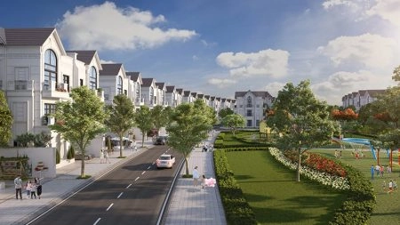 Con đường nội khu với hàng biệt thự trắng kiến trúc tân cổ điển và công viên cây xanh, khu vui chơi trẻ em