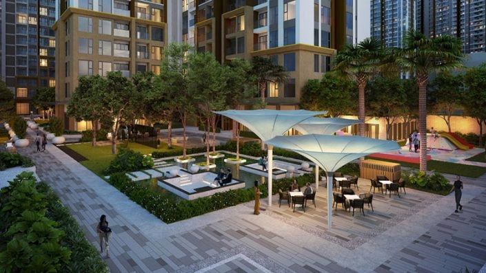 Khu vực tiện ích ngoài trời với ghế ngồi, dù che và cây xanh, có khu vui chơi trẻ em