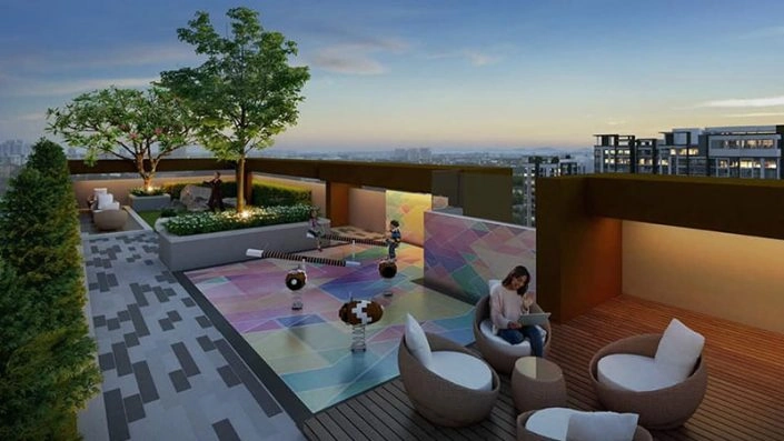 Sân chơi trẻ em trên tầng thượng với thiết kế đầy màu sắc và khu vực ghế ngồi thư giãn