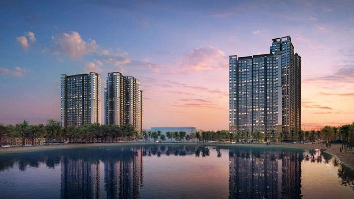 Phối cảnh các tòa nhà cao tầng phản chiếu trên mặt hồ vào buổi hoàng hôn