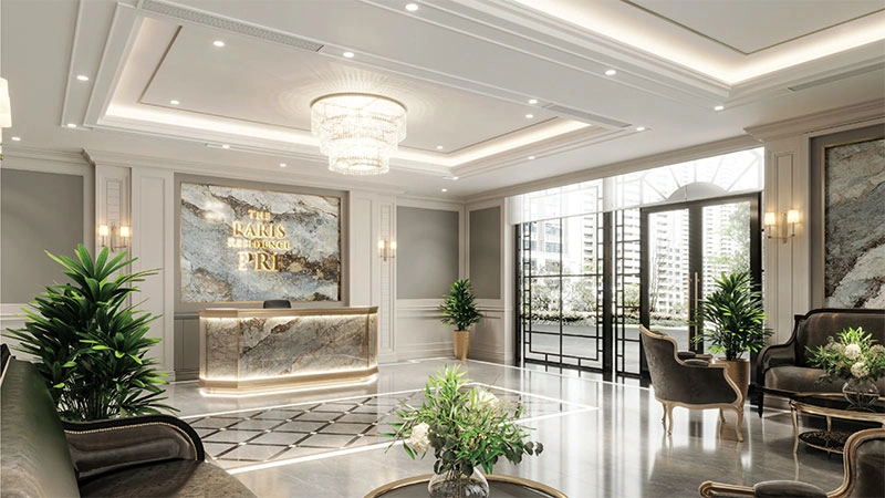 Sảnh lễ tân sang trọng với quầy đá cẩm thạch, đèn chùm pha lê và nội thất cao cấp