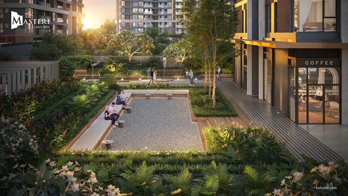 Khu vườn cảnh quan với ghế ngồi thư giãn và quán cà phê ngoài trời, nằm giữa các tòa nhà tại Masteri Lakeside
